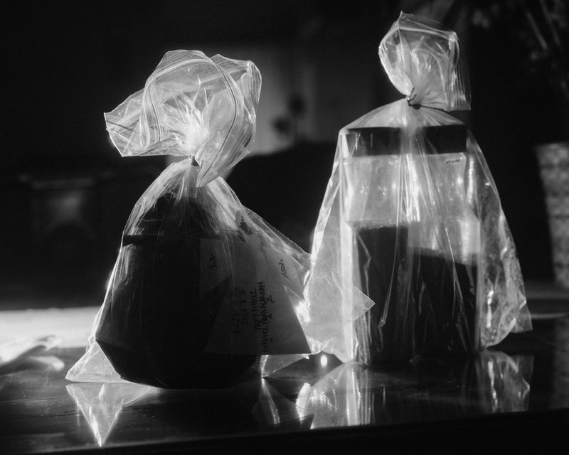 © Brian Lau - Dad's ashes in lemonade bottles