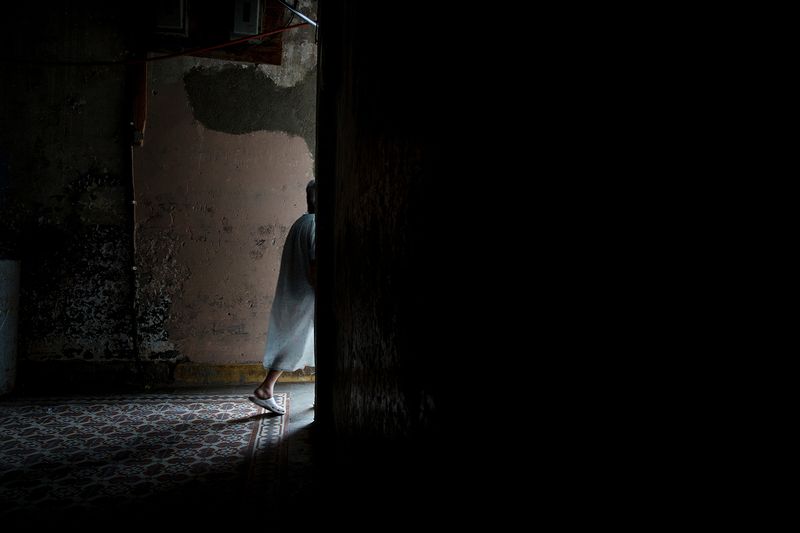 © Oded Wagenstein - Berta walking down the corridor of the elderly's apartment complex. Cienfuegos, Cuba. 