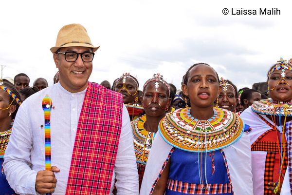 © Laissa Malih - Minister of tourism Najib Balala and alongside a. Samburu woman singing.
