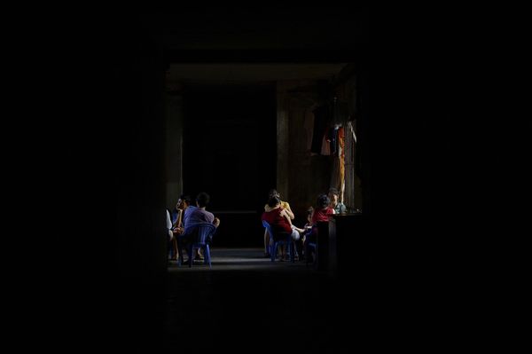 © Laurent Weyl - 1st floor in café Bun Bo Hue during a power cut.