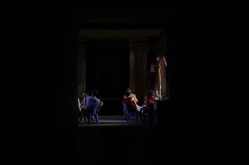 © Laurent Weyl - 1st floor in café Bun Bo Hue during a power cut.