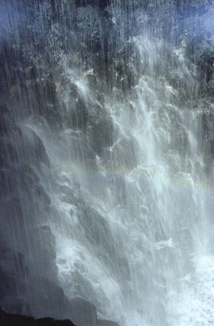 The waterfall fills the river