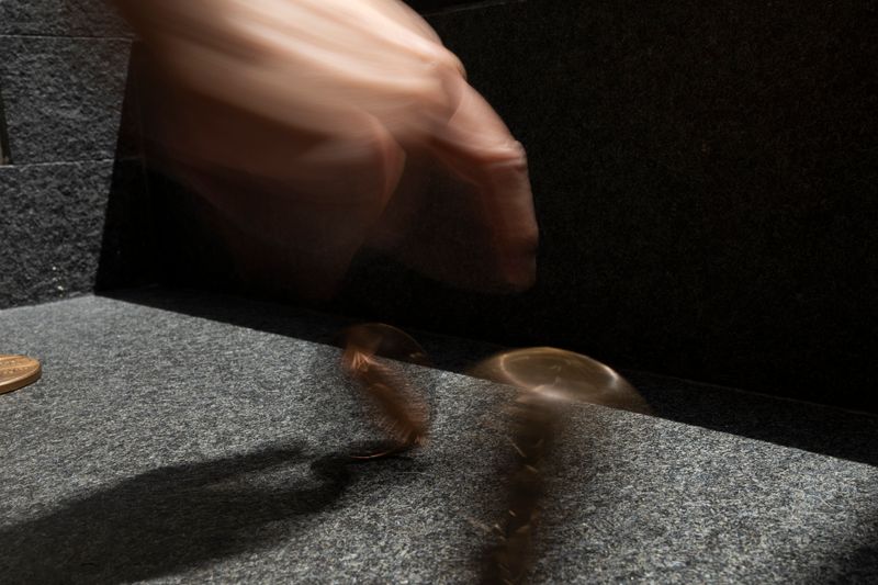 © Orly Morgenstern - The hand of the puppet master and the coins of time: past, present, and future