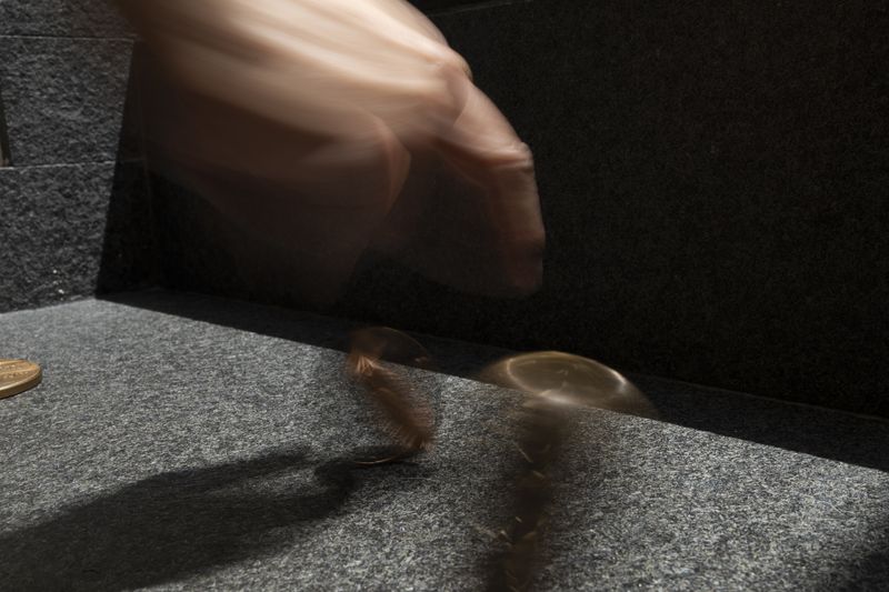 © Orly Morgenstern - The hand of the puppet master and the coins of time: past, present, and future