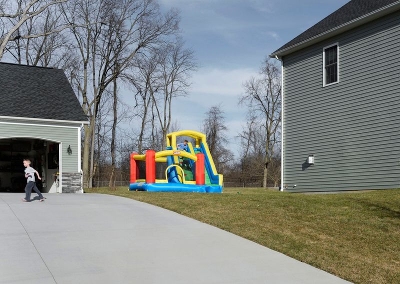 © Graeme Williams - Suburbs of Harrisburg, USA. 2016. The only splash of colour within a monotonous sprawl of houses.