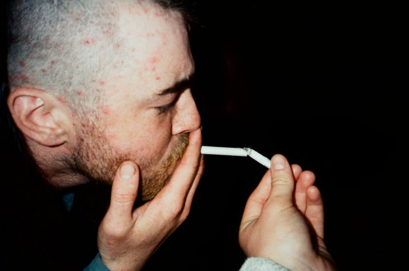 © Aidan Clark - Lighting another planters cigarette with my own.