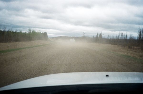 © Aidan Clark - Driving the logging road into camp.