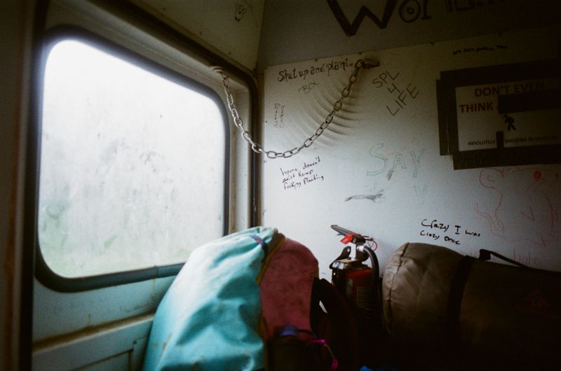 © Aidan Clark - Writing on the walls of the "Crummy". The vehicle that takes planters to and from the helicopter staging area.