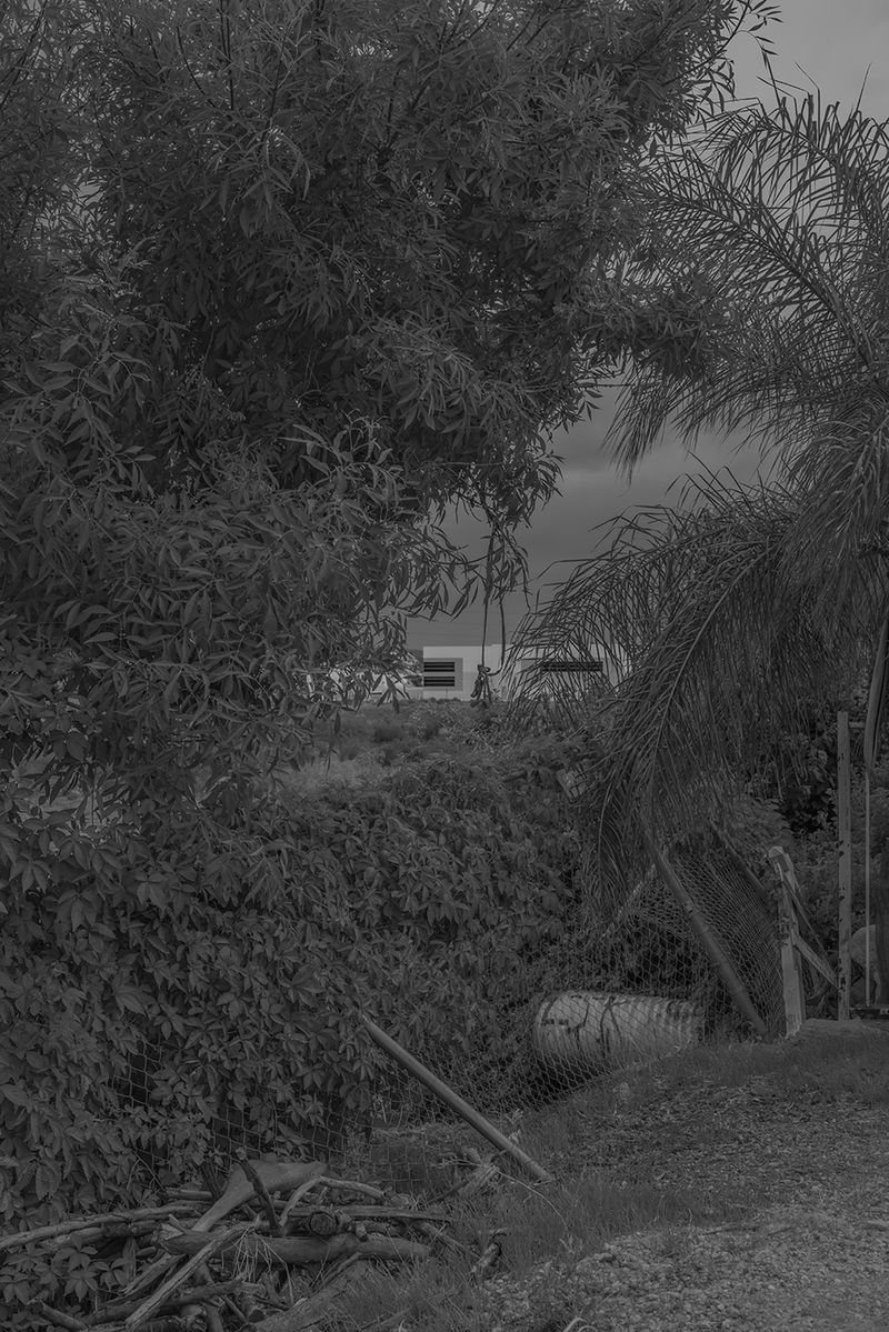 © Vera Saldivar - Amazon Warehouses seen from a backyard in Fontana, California