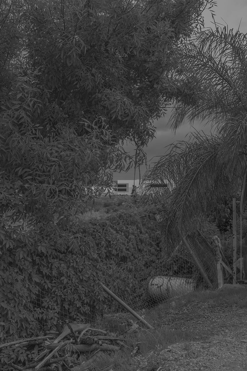 © Vera Saldivar - Amazon Warehouses seen from a backyard in Fontana, California