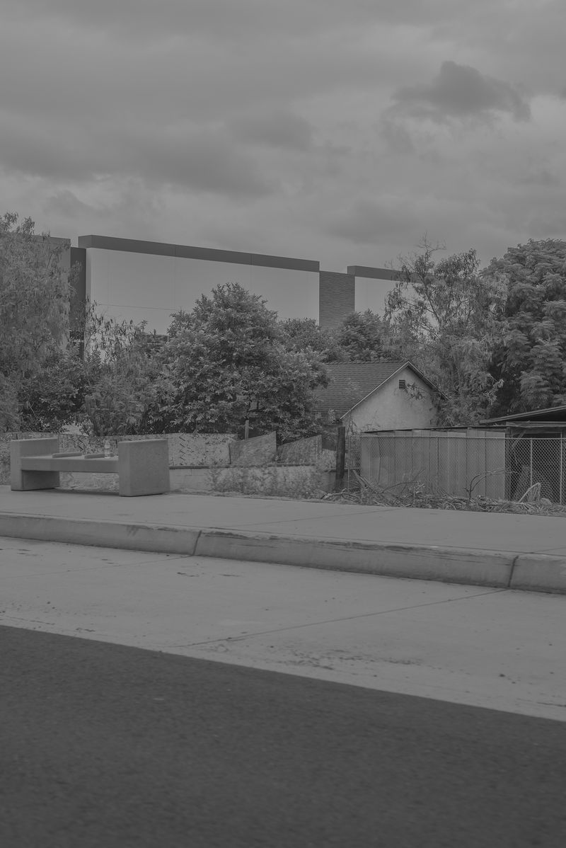 © Vera Saldivar - Vacant warehouses surrounding a small home in Fontana, California
