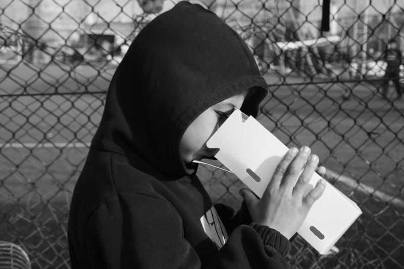 © Ali Rıza Yıldırım - A young boy admiring his newly acquired bird.