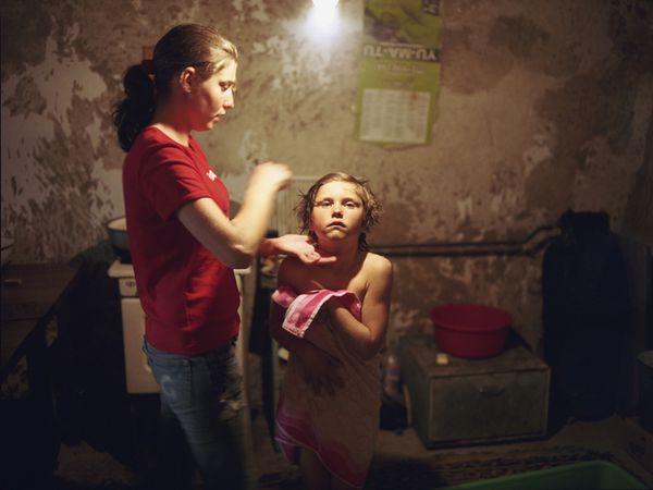 © Andrea Diefenbach - Marina is taking care of her sister Gabi. Their mother lives and works in Italy, the father often works in Russia.