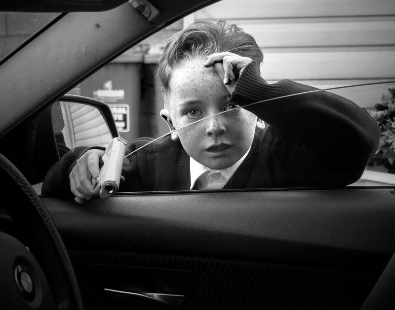 © Rebecca Moseman - A young boy emerged from his caravan in Limerick, Ireland, holding a pellet gun to see who had come to visit.