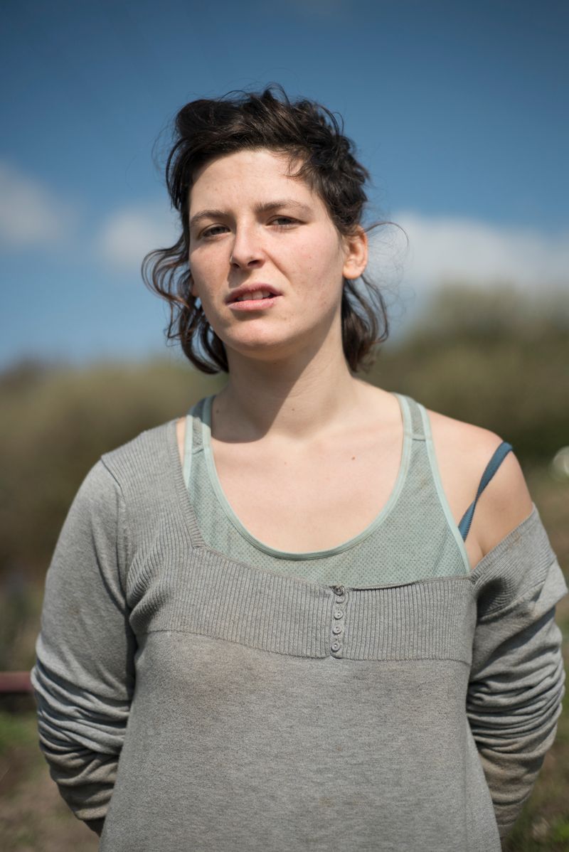 © Penelope Thomaidi - Sarah, inhabitant of the ZAD, in the medicinal garden of Le Moulin collective. March 2018.