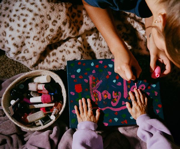 © Logan  White - Anna paints Kaylee's nails her favorite color pink.