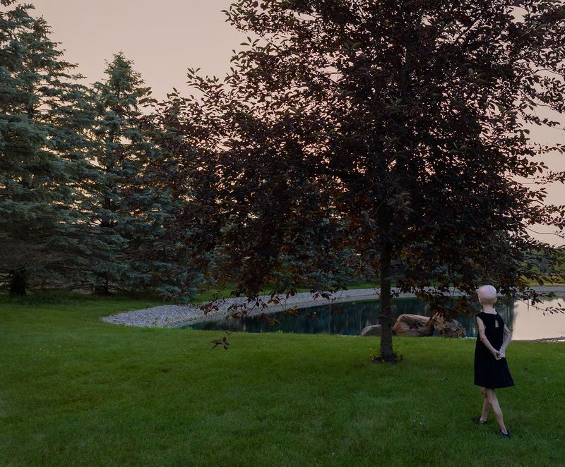 © Logan  White - Kaylee in her backyard at sunset.