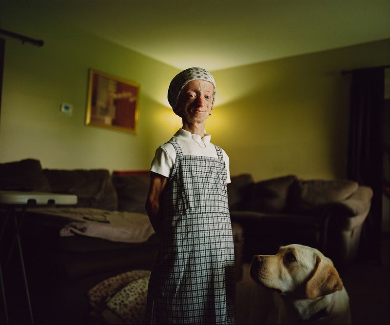 © Logan  White - Kaylee and Iris in their living room in Ohio.