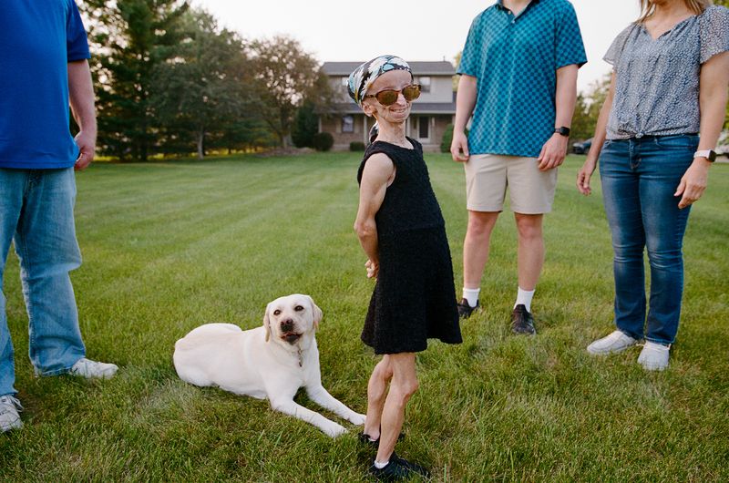 © Logan  White - Kaylee and her family outside their home in Ohio.