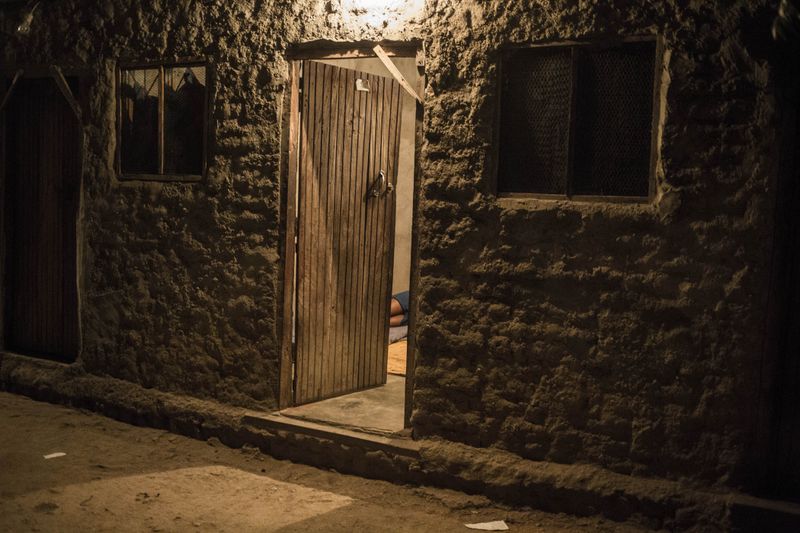 © TaraTW - A sex worker lies inside her room at a "hotspot" in Tete, Tete province, Mozambique May 11, 2018.