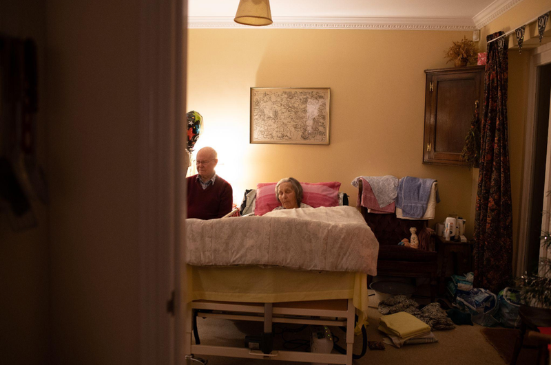 © Sophia Nasif - My grandparents, with my grandmother in her hospital bed, surrounded by all of her care paraphernalia.