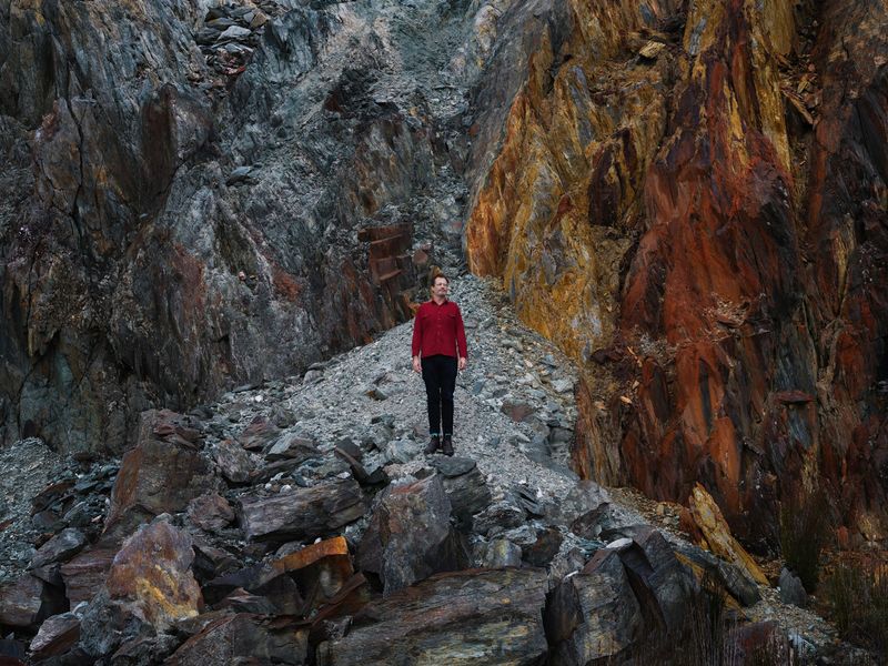 © Sarah Rhodes - The man hovers above the sheer rock as though he and the place have a magnetic connection.