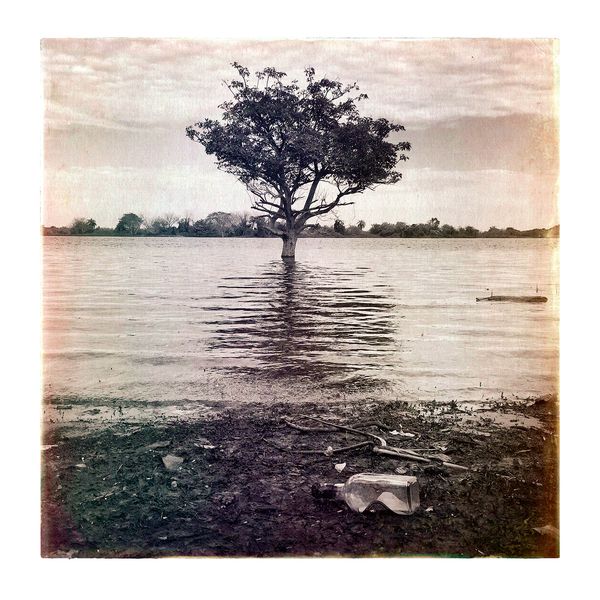 © Marcelo David Sandoval - A bottle of "caña" after the floods