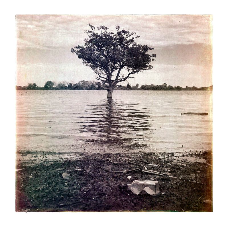 © Marcelo David Sandoval - A bottle of "caña" after the floods