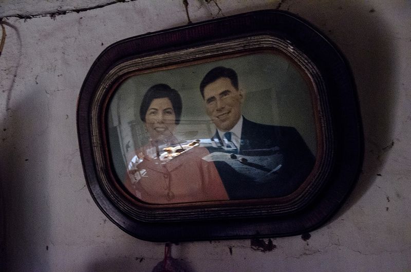 © Marcelo David Sandoval - The portrait of Aurora and Andres Sanchez still hangs on the wall of a forsaken hut. They lived there before passing away.
