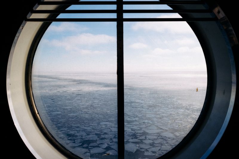 © Emine Gozde Sevim - Untitled from the series, Sininen Hetki, 2026. (View of the frozen Baltic sea from Helsinki harbor)
