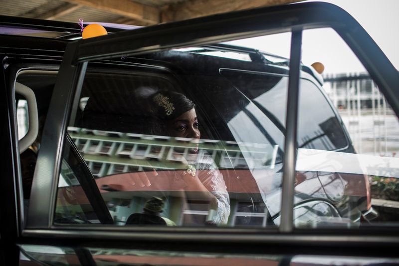 © Glenna Gordon - A bride gets ready to go into a hall at the Lagos Sports Stadium.
