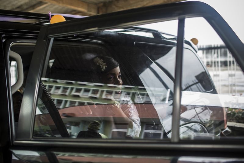 © Glenna Gordon - A bride gets ready to go into a hall at the Lagos Sports Stadium.