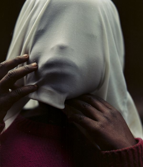 © Cécile Smetana - Madonna, Roses babysister is playing outside of her home on the island of Idjwi.