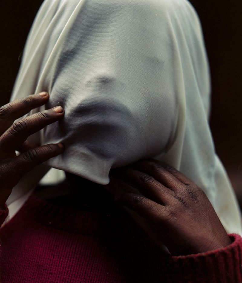 © Cécile Smetana - Madonna, Roses babysister is playing outside of her home on the island of Idjwi.