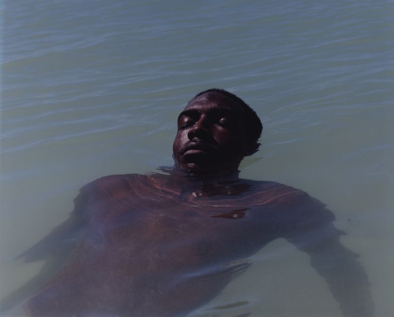 © Cécile Smetana - Nathan like many other Guadeloupe's swim, surf and enjoy the clear  waters around the island.