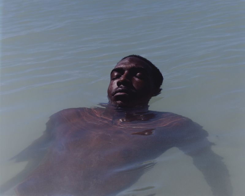 © Cécile Smetana - Nathan like many other Guadeloupe's swim, surf and enjoy the clear  waters around the island.