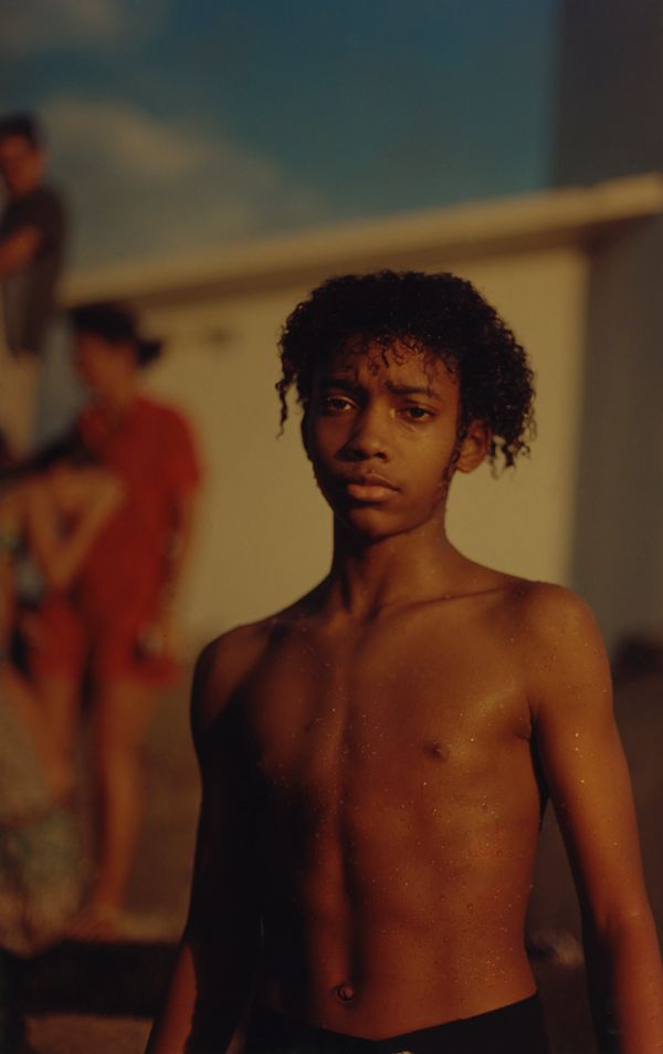 © Cécile Smetana - Boy swimming by the rocks at Vieux Fort at Basse Terre