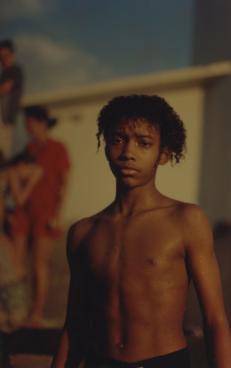 © Cécile Smetana - Boy swimming by the rocks at Vieux Fort at Basse Terre