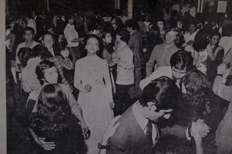 © Santiago Escobar-Jaramillo - Newspaper clipping of a photo shows the beauty pageant dancing alone in the Social Club of Manizales, Colombia.