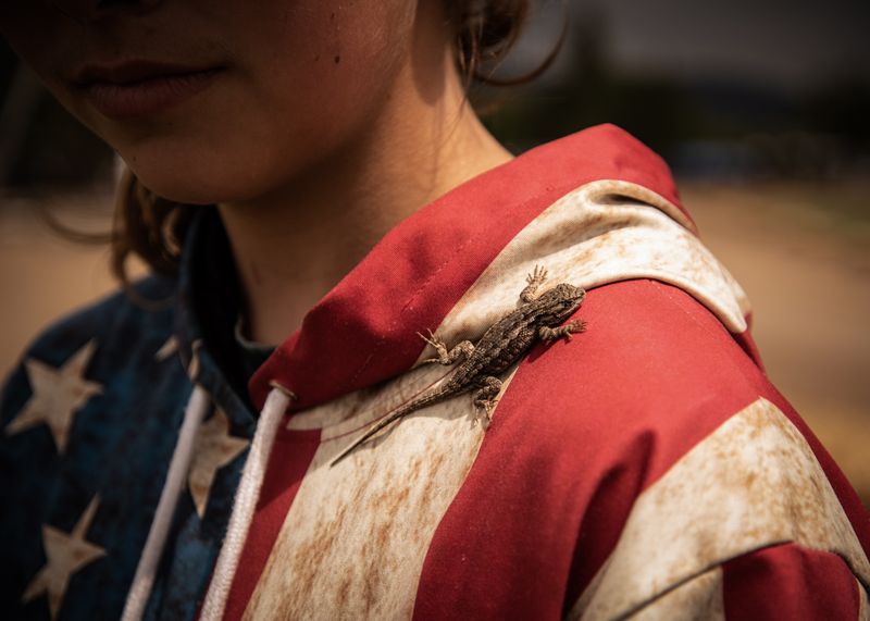 © Rosie Day - Emma (Age 13) collects blue belly lizards to sell for $1 each. Wamic, Oregon (Pop. 36)