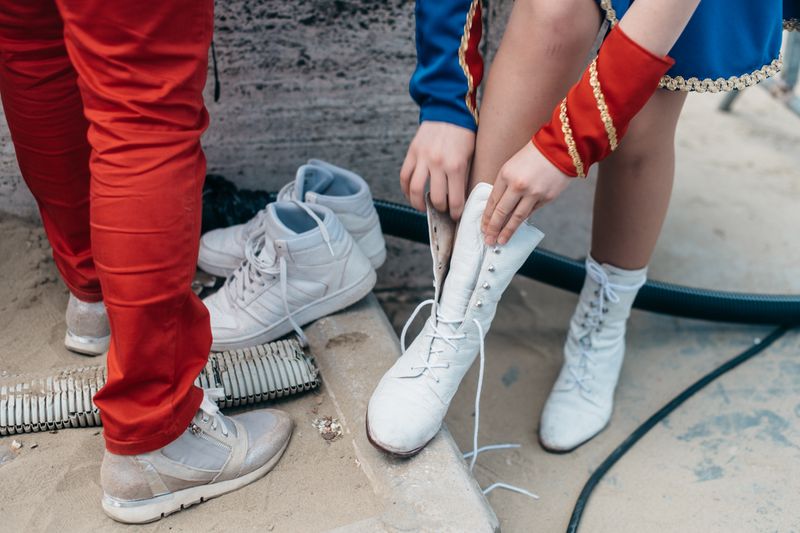 © Agnese Morganti - Viareggio, 2017. A majorettes changes into her white boots.