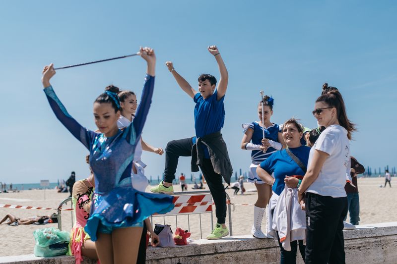 © Agnese Morganti - Viareggio, 2017. Majorettes rehearsing backstage with their support team of family and friends.