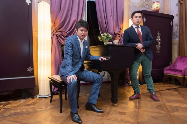 © Agnese Morganti - Florence, Two young members of a Chinese association gather for a meeting.