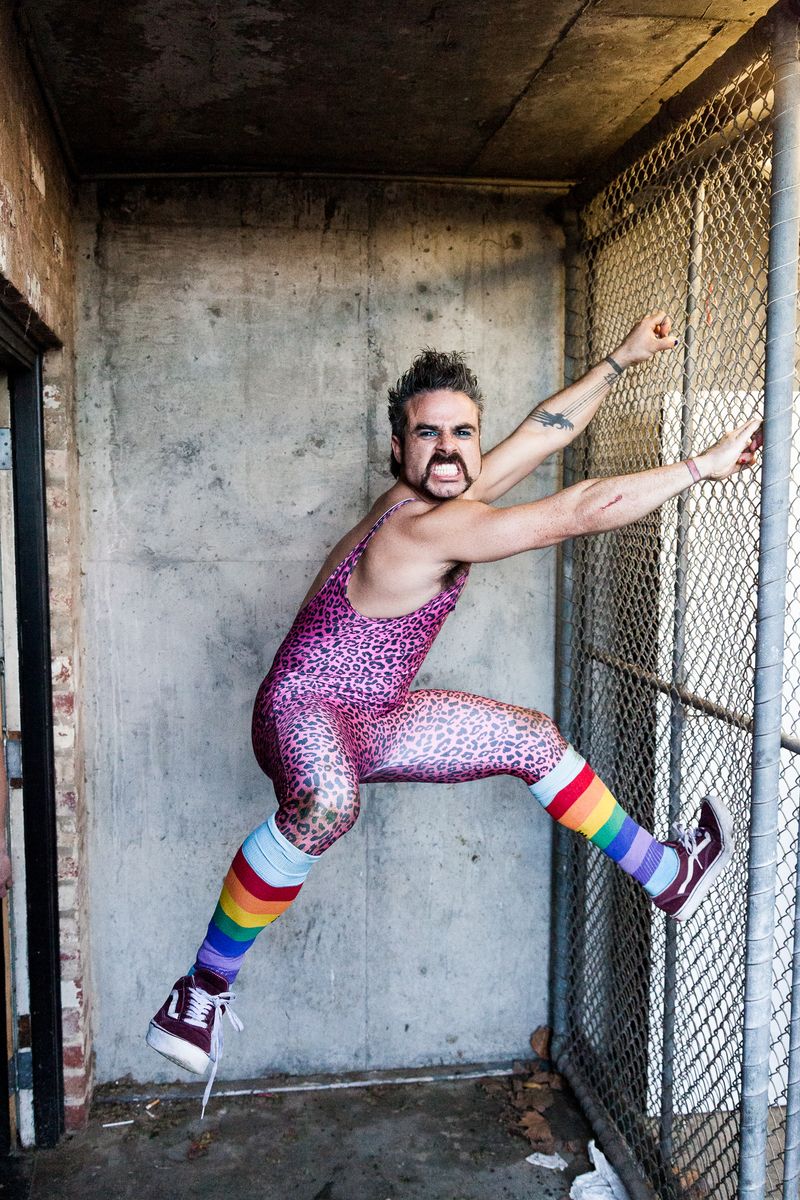© J Forsyth - Rosco, always in a onsie or costume climbs the fence to pose for his footy card photo