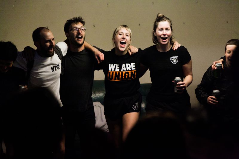© J Forsyth - Eye Gougers players celebrate and sing their song after a win