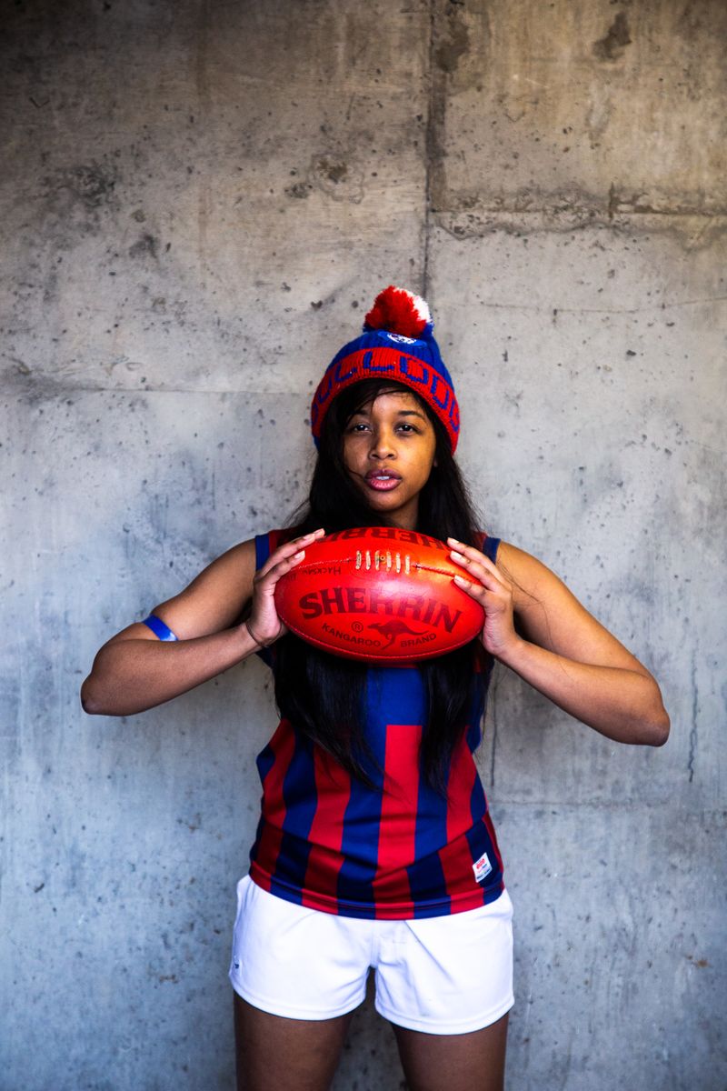 © J Forsyth - Player poses for footy card photo