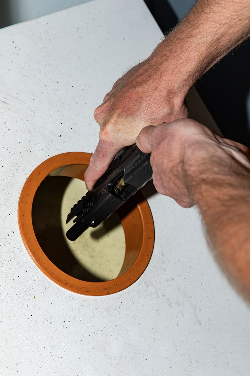 © Lukas Ratius - Customs officer loading his gun before starting duty at the main customs office in Saarbrücken