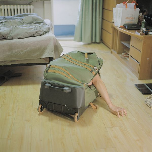 © Pang Hai - The box is home: Me in the box? This is my space. It's small, but it's quiet. It can also take me anywhere.