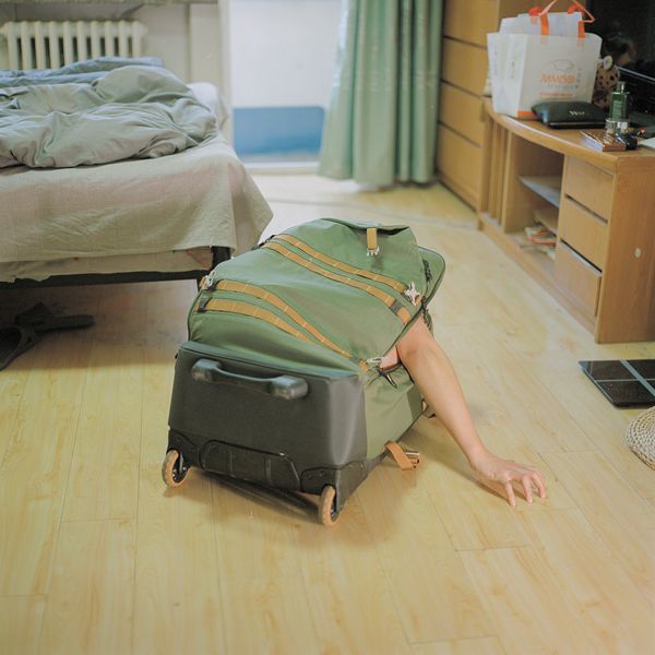 © Pang Hai - The box is home: Me in the box? This is my space. It's small, but it's quiet. It can also take me anywhere.