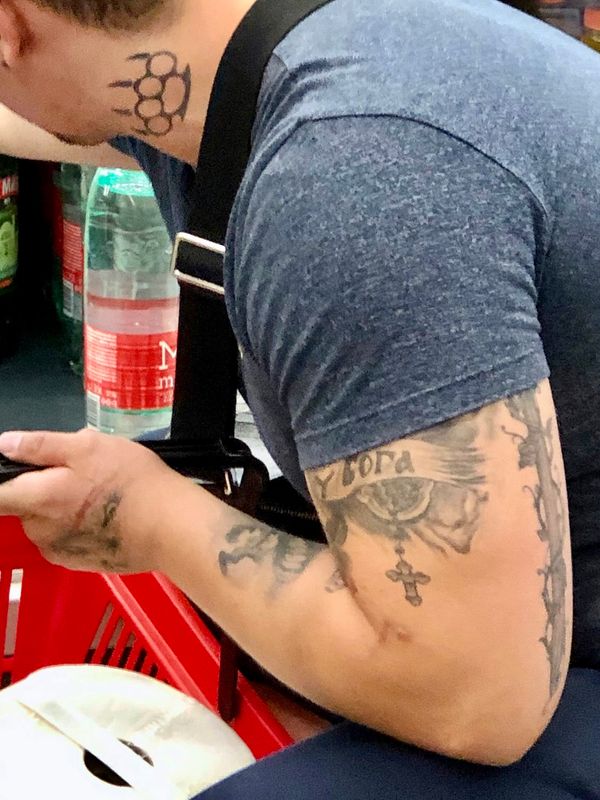 © Filip Bojovic - The tattoo says "БОГА" god in Serbian Cyrillic script.